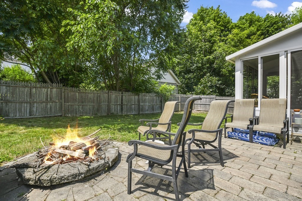 4 Maxdale Road Worcester, MA 01602 - Photo 27 of 28 a view of a chair and fire pit in the backyard
