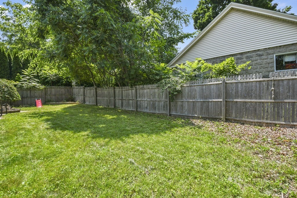 4 Maxdale Road Worcester, MA 01602 - Photo 28 of 28 a view of a backyard with a small cabin and a chair