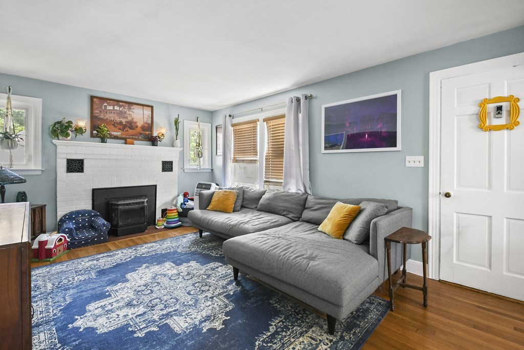 4 Maxdale Road Worcester, MA 01602 - Photo 3 of 28 a living room with furniture a flat screen tv and a fireplace