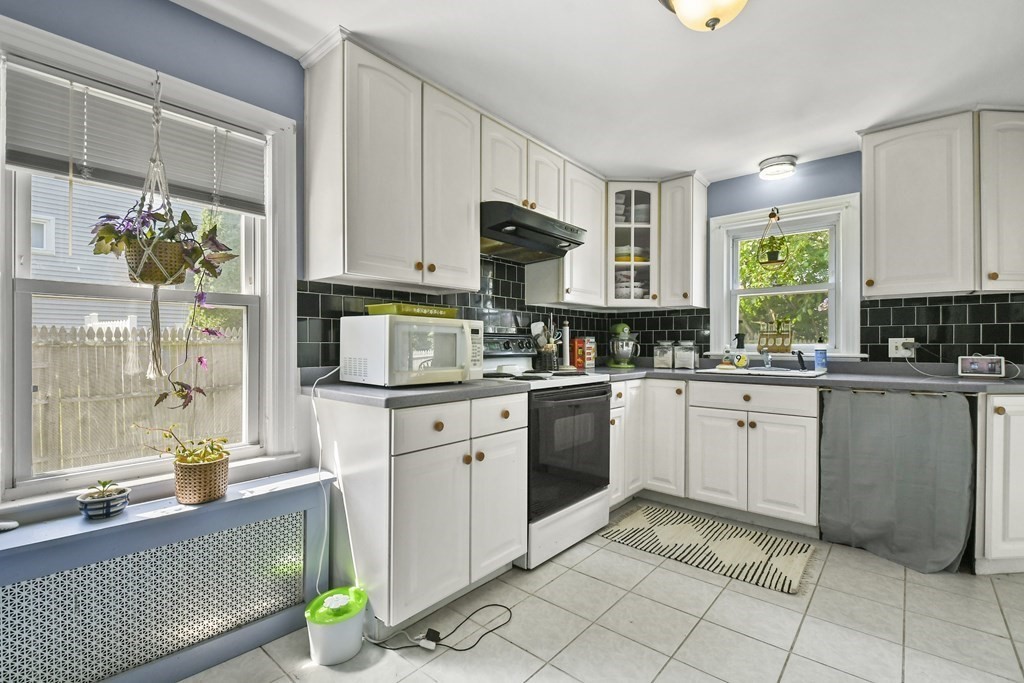 4 Maxdale Road Worcester, MA 01602 - Photo 8 of 28 a kitchen with a sink cabinets and window