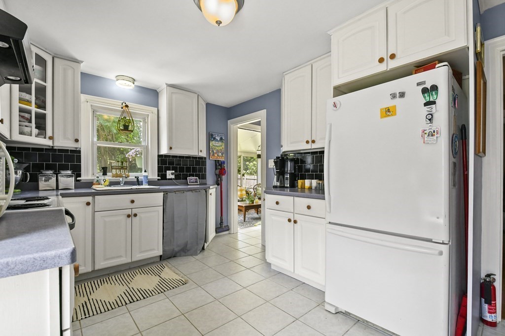 4 Maxdale Road Worcester, MA 01602 - Photo 9 of 28 a kitchen with white cabinets and white appliances