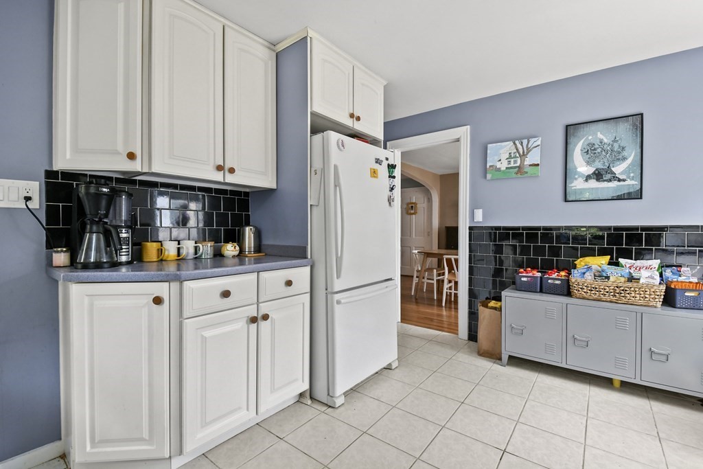 4 Maxdale Road Worcester, MA 01602 - Photo 10 of 28 a kitchen with stainless steel appliances a refrigerator and a stove top oven