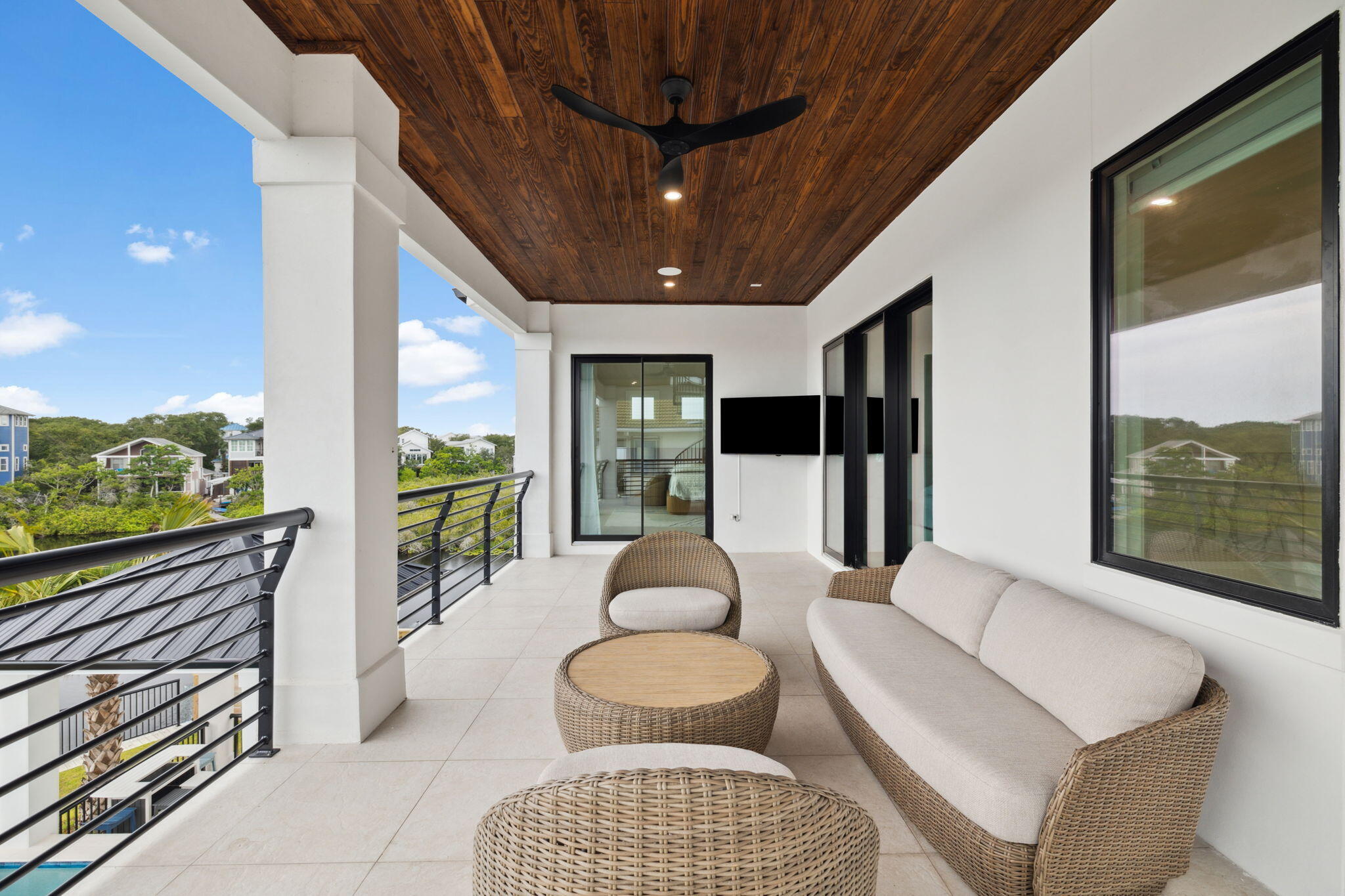 92 Southern Cross Ln Inlet Beach Inlet Beach, FL 32461 - Photo 16 of 19 a living room with furniture and a floor to ceiling window
