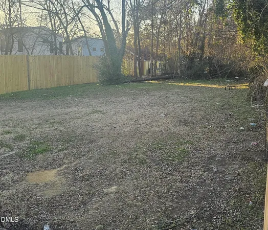 a view of a yard with a tree