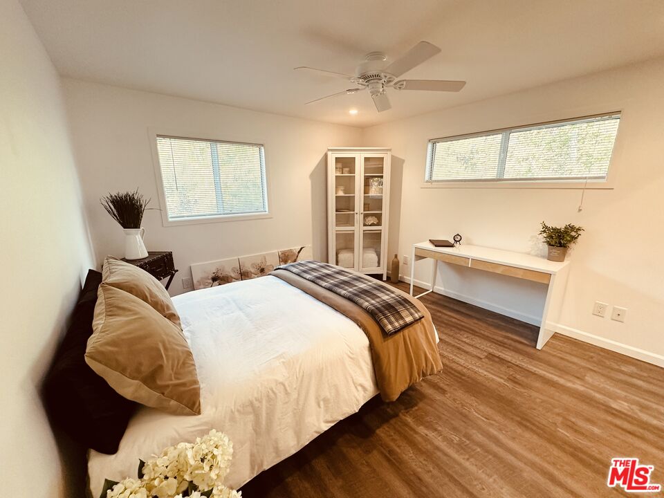 2039 Tuna Canyon Road, Unit B Topanga, CA 90290 - Photo 19 of 19 a spacious bedroom with a bed and wooden floor