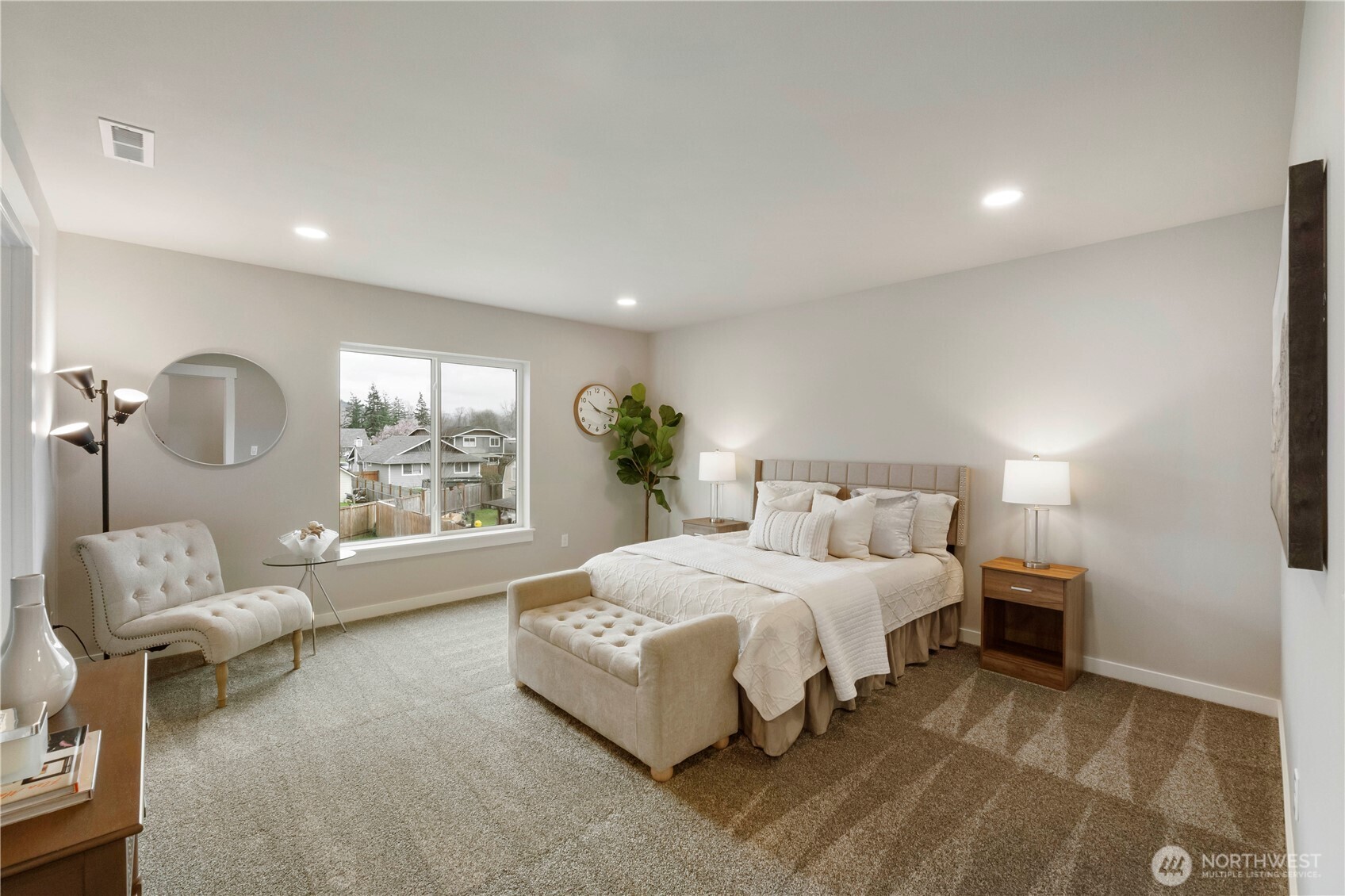 528 Harman Way South Orting, WA 98360 - Photo 16 of 30 a spacious bedroom with a bed and a large window