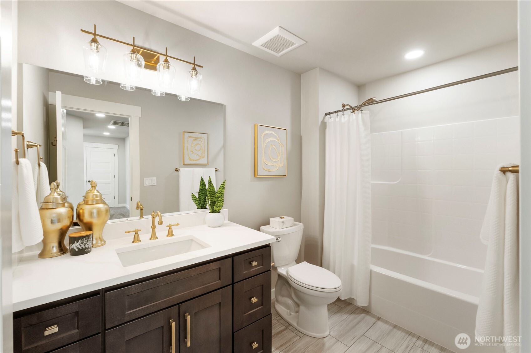528 Harman Way South Orting, WA 98360 - Photo 22 of 30 a bathroom with a sink a toilet and shower