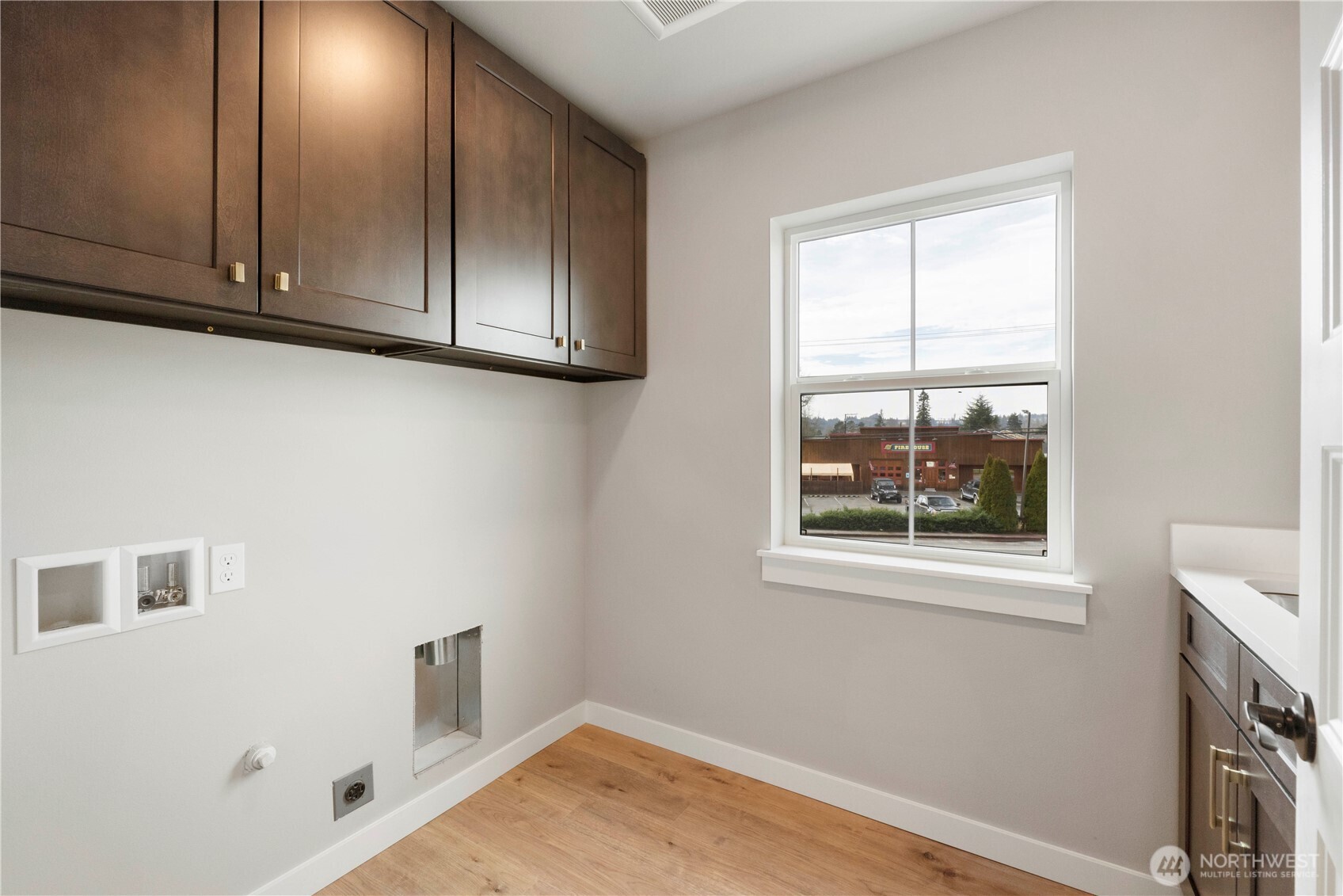 528 Harman Way South Orting, WA 98360 - Photo 24 of 30 a view of empty room with window and wooden floor