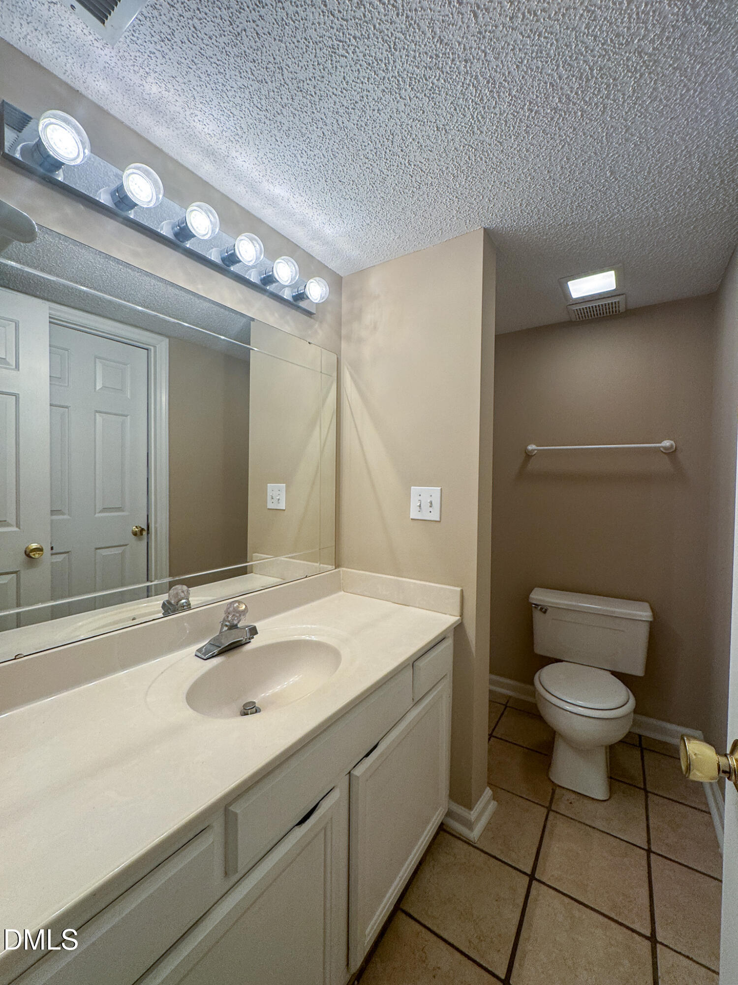 4101 Five Oaks Drive, Unit 10 Durham, NC 27707 - Photo 17 of 29 a bathroom with a sink and a mirror