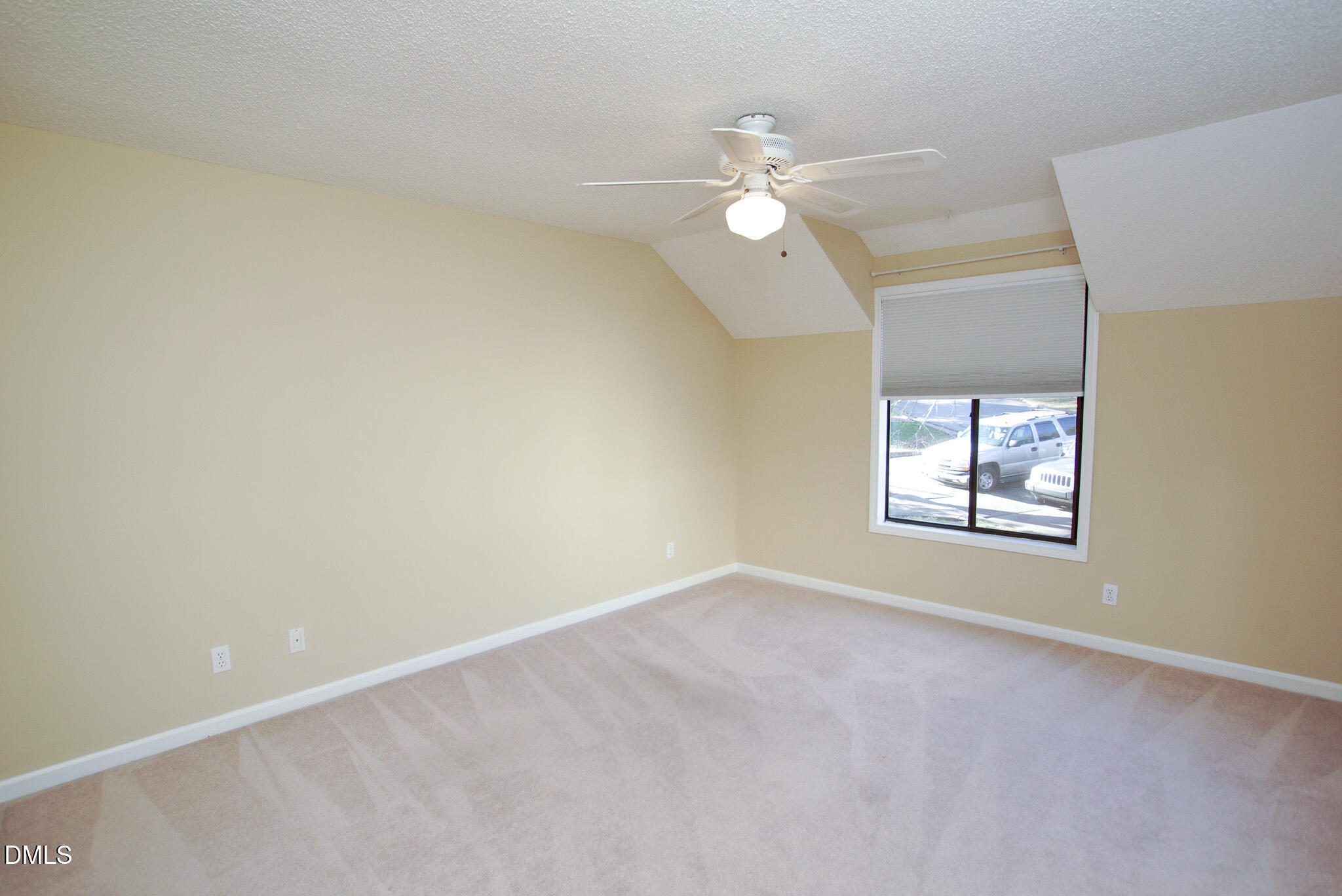 4101 Five Oaks Drive, Unit 10 Durham, NC 27707 - Photo 20 of 29 an empty room with a window and chandelier fan