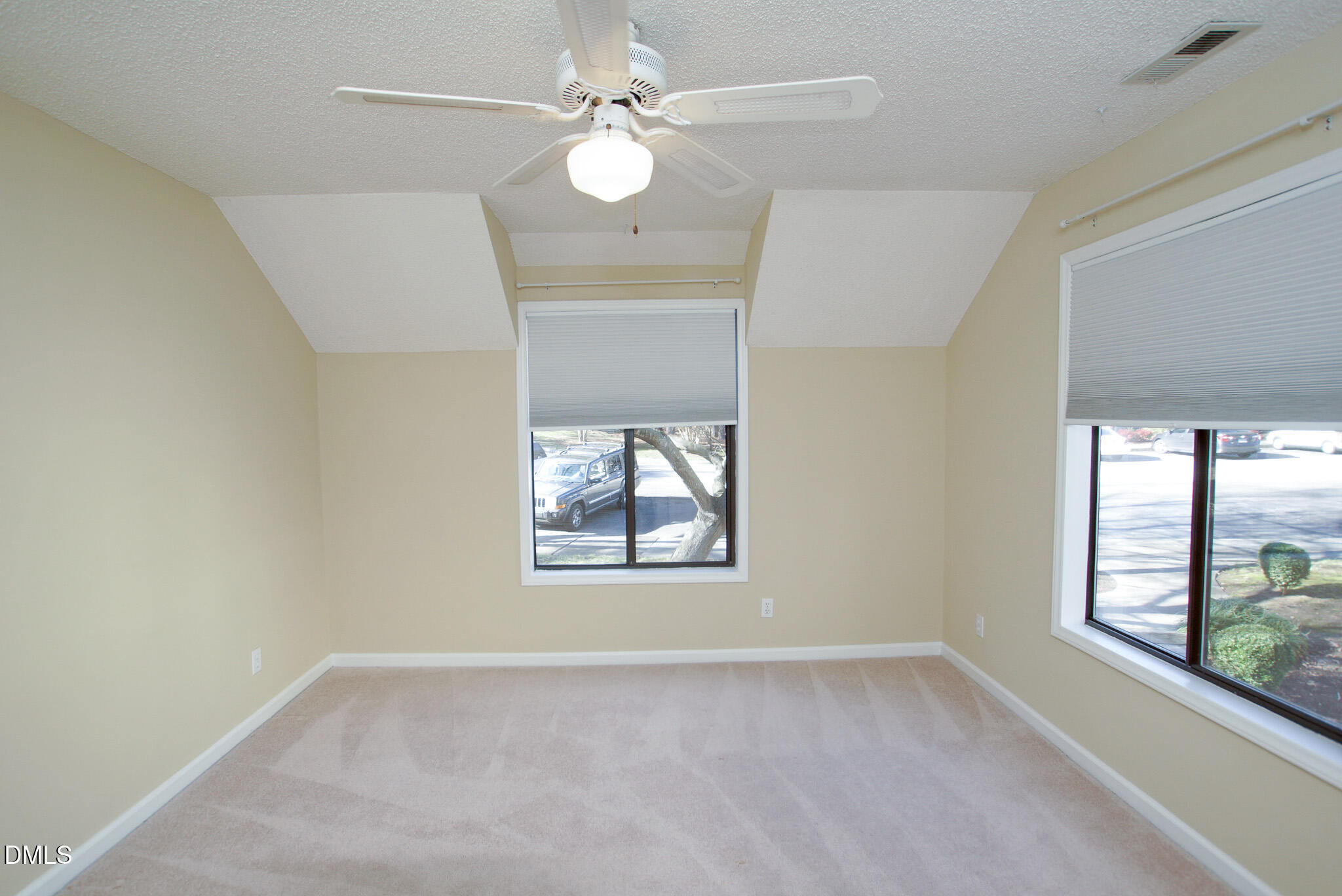 4101 Five Oaks Drive, Unit 10 Durham, NC 27707 - Photo 21 of 29 an empty room with windows and fan