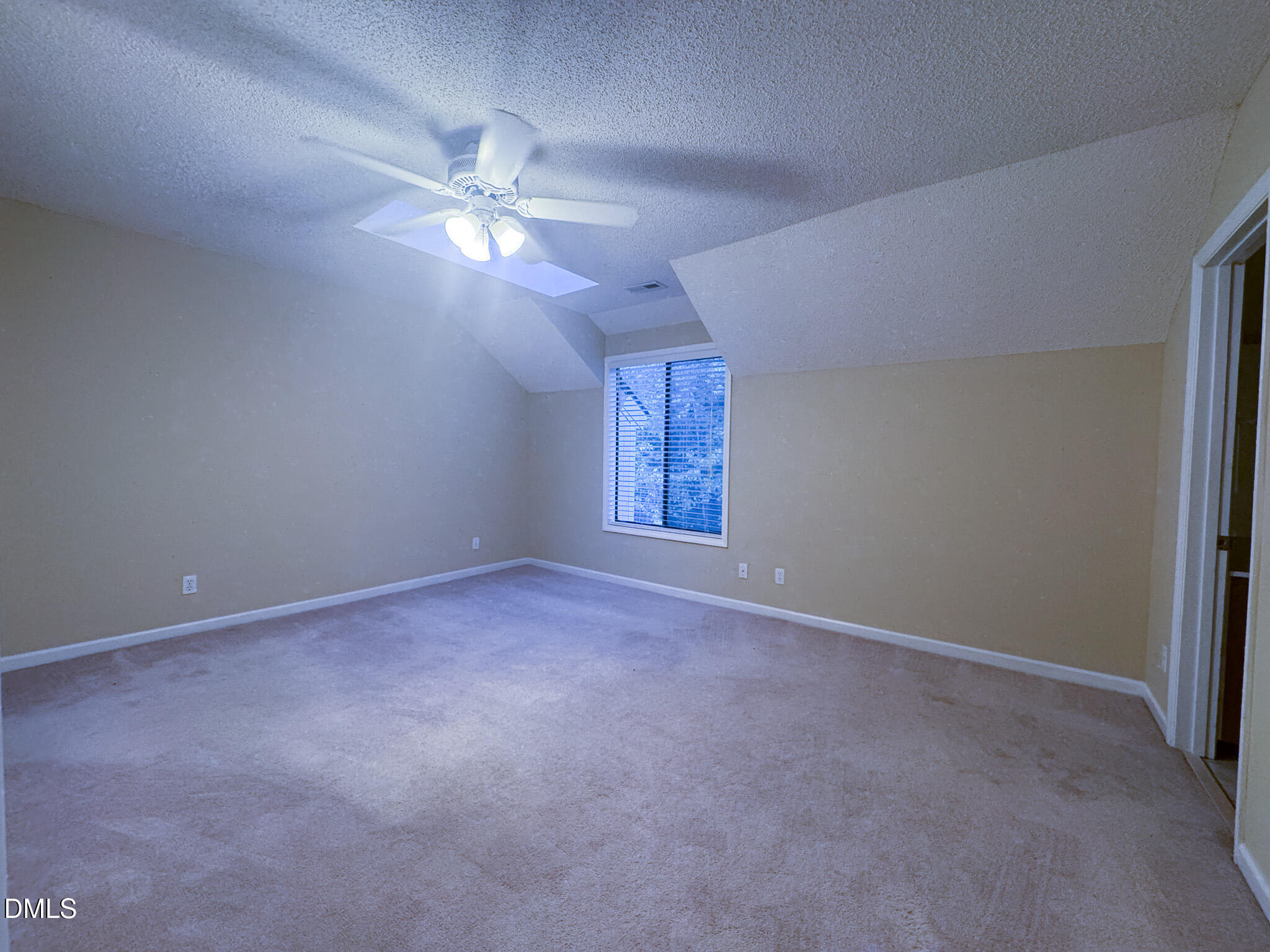 4101 Five Oaks Drive, Unit 10 Durham, NC 27707 - Photo 24 of 29 a view of a room with a ceiling fan and window