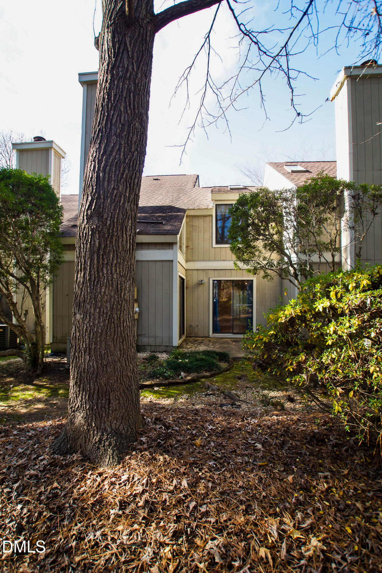 4101 Five Oaks Drive, Unit 10 Durham, NC 27707 - Photo 28 of 29 a view of a yard in front of a house with large tree