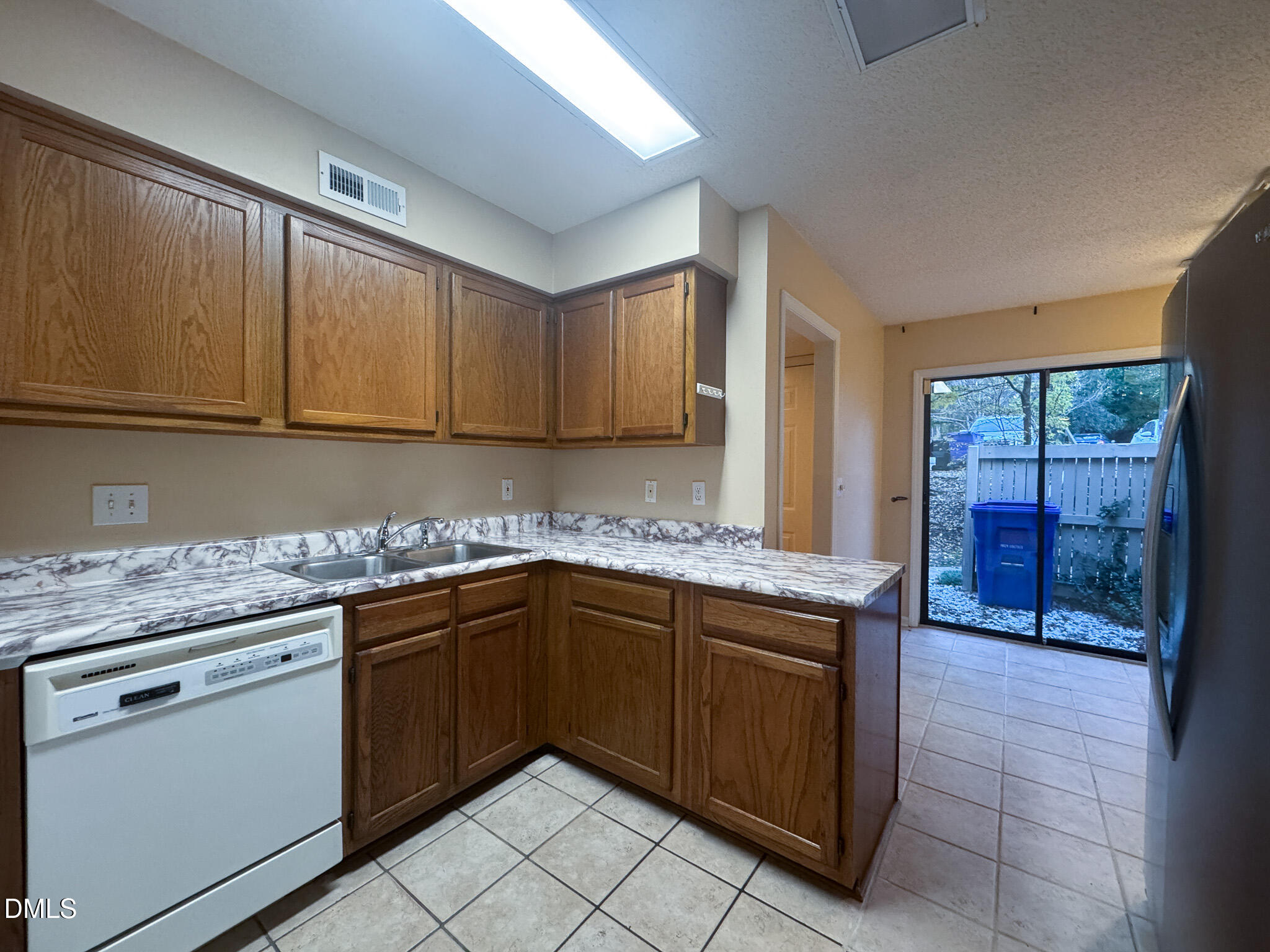 4101 Five Oaks Drive, Unit 10 Durham, NC 27707 - Photo 9 of 29 a kitchen with a sink stove and cabinets