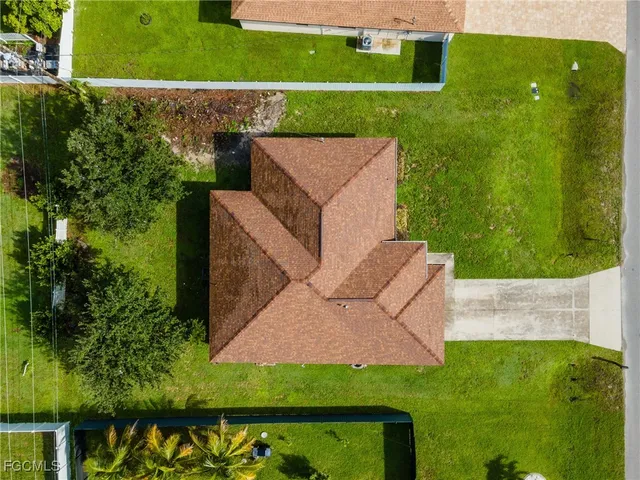 an aerial view of a house with a garden