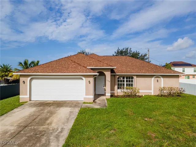 front view of a house with a yard