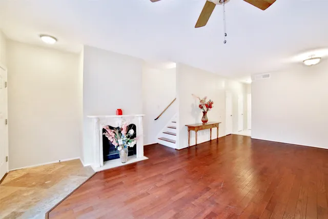 a view of a livingroom with wooden floor and toys