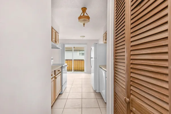 a view of a hallway with a door