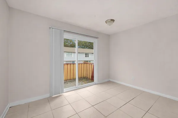 a view of an empty room with a window