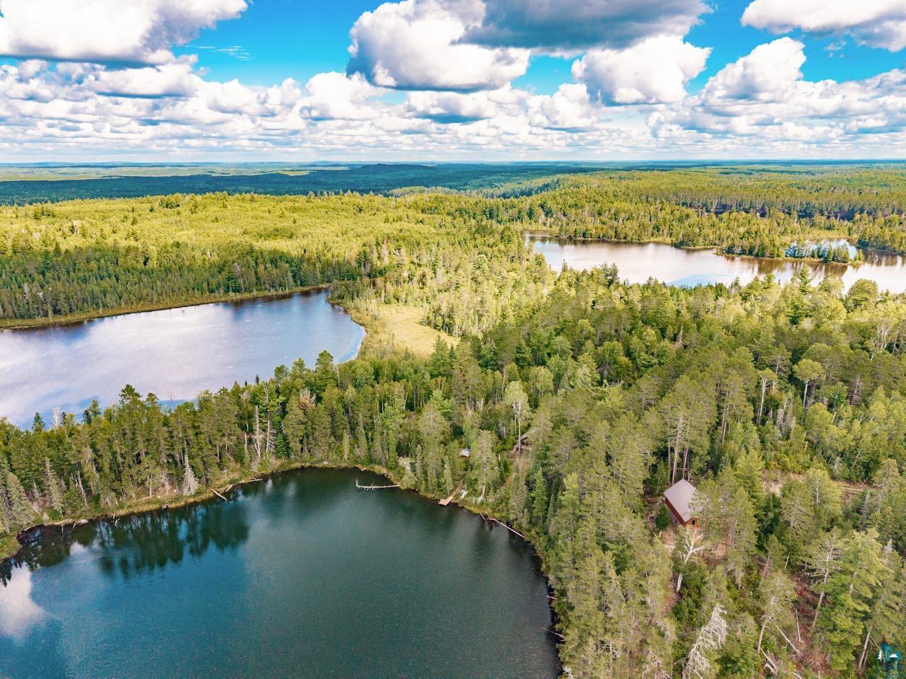 10401 Gunsten Lake Road Isabella, MN 55607 - Photo 27 of 91 Forested landscape with three bodies of water and a secluded structure