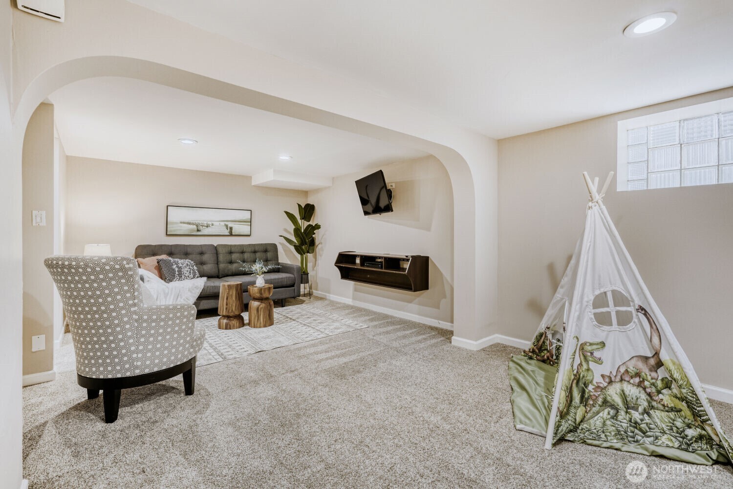 348 Northeast 57th Street Seattle, WA 98105 - Photo 13 of 28 a living room with furniture and a wooden floor