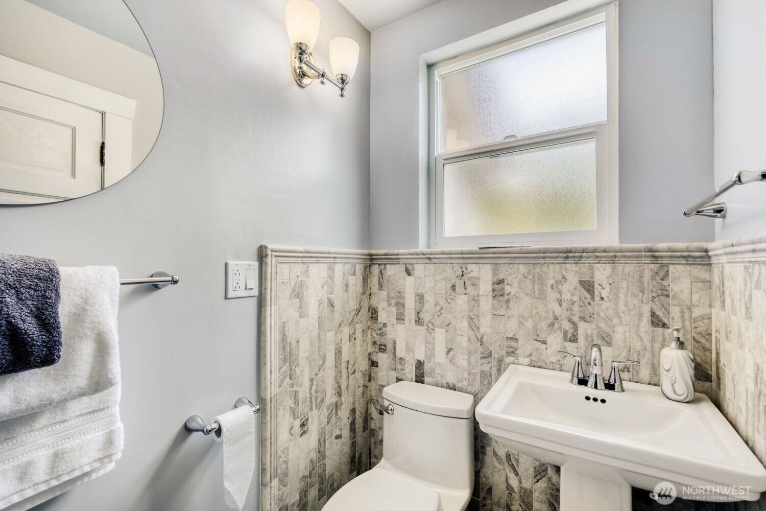 348 Northeast 57th Street Seattle, WA 98105 - Photo 21 of 28 a bathroom with a sink mirror and toilet
