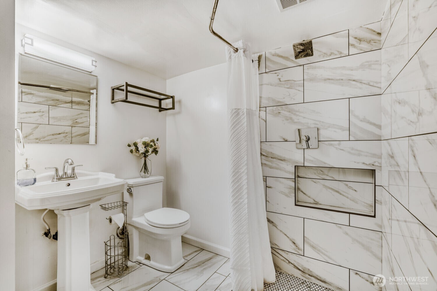 348 Northeast 57th Street Seattle, WA 98105 - Photo 22 of 28 a bathroom with a sink toilet and shower