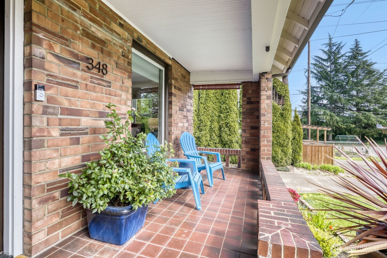 348 Northeast 57th Street Seattle, WA 98105 - Photo 4 of 28 a view of a patio with table and chairs and potted plants