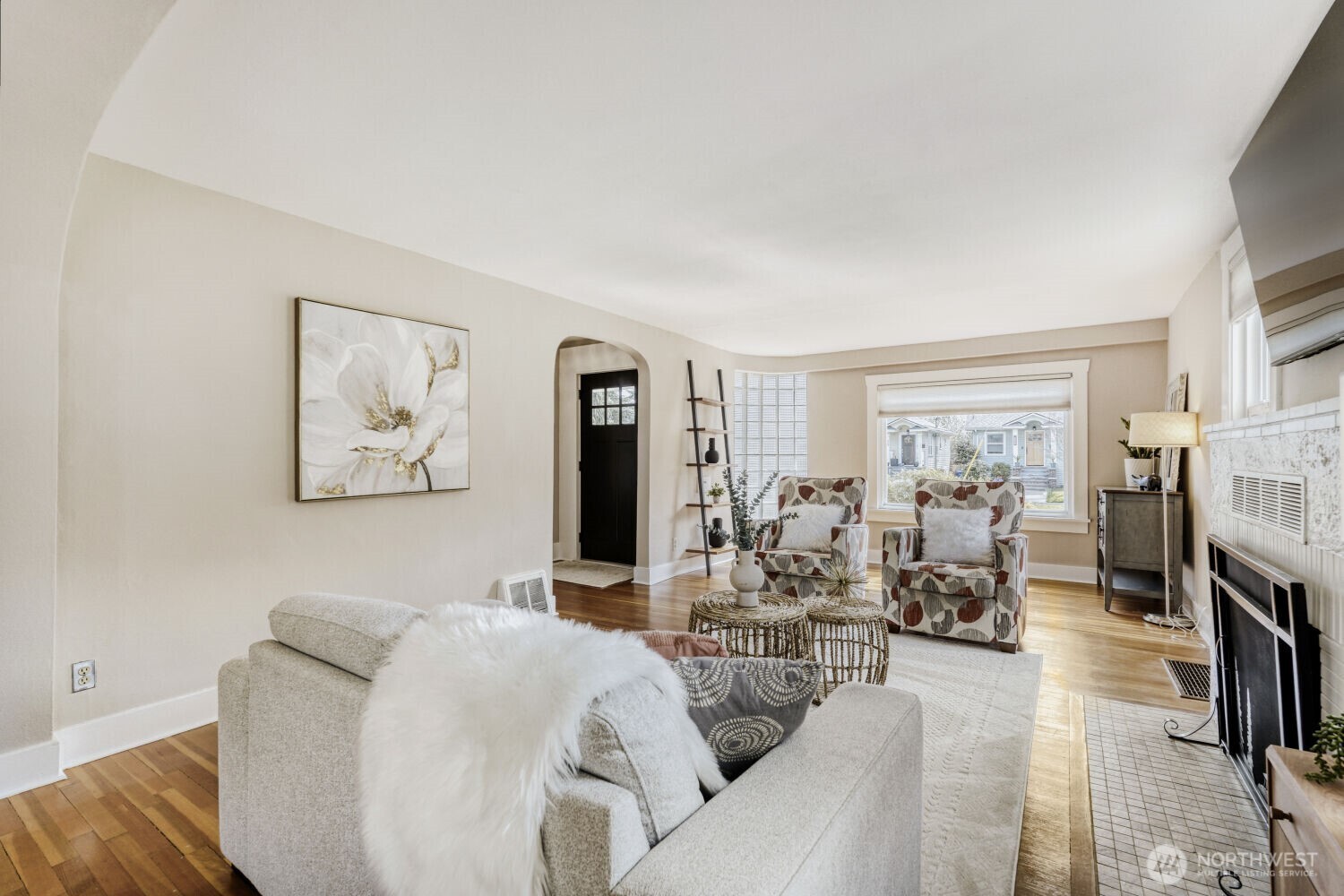 348 Northeast 57th Street Seattle, WA 98105 - Photo 6 of 28 a living room with furniture and a fireplace