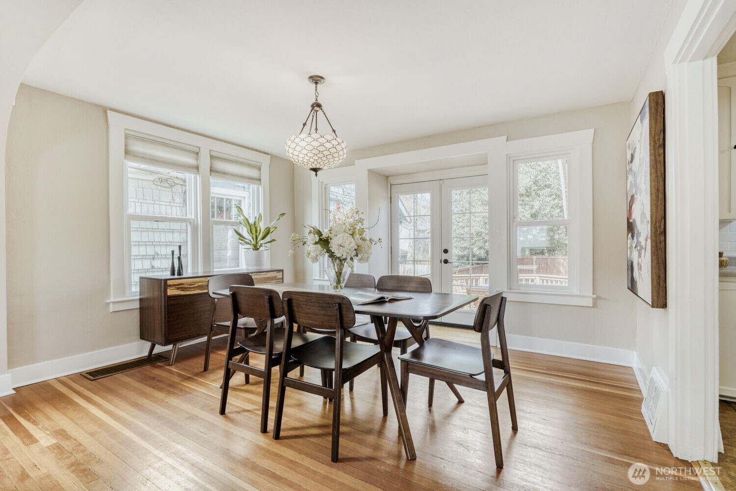 348 Northeast 57th Street Seattle, WA 98105 - Photo 8 of 28 a view of a dining room with furniture window and wooden floor