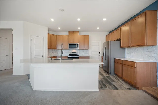 a kitchen with a sink and cabinets