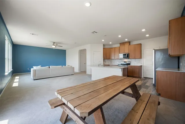 a kitchen with sink cabinets and wooden floor