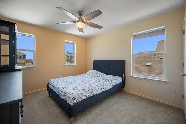 a bedroom with a bed and dresser