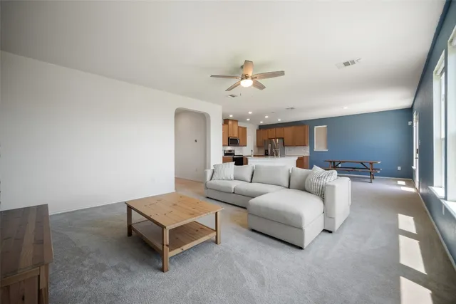 a bed room with a bed and a chandelier