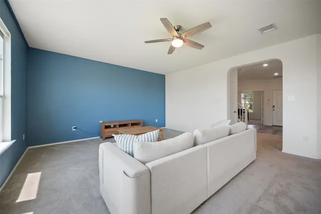 a kitchen with a sink and white cabinets