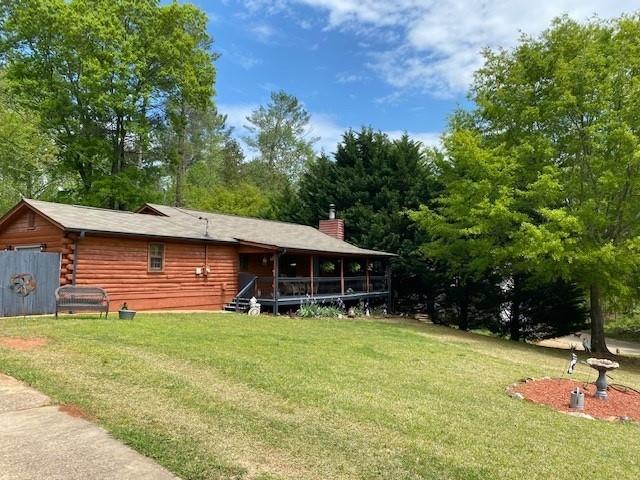 3325 Fork Road Gainesville, GA 30506 - Photo 1 of 1 a view of a house with a yard and sitting area