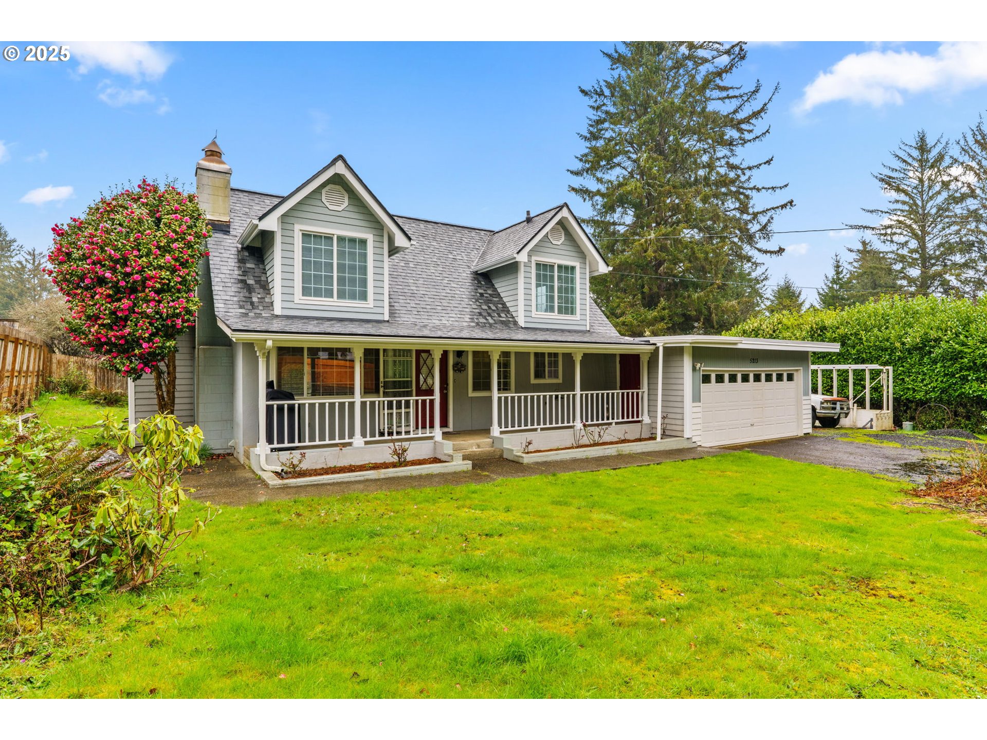 5213 Hilltop Drive Florence, OR 97439 - Photo 2 of 32 a view of a house with a yard and sitting area