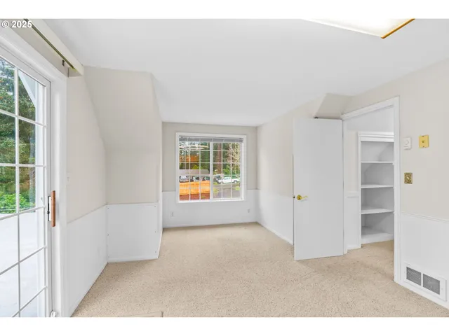 a bathroom with a sink a toilet and a window