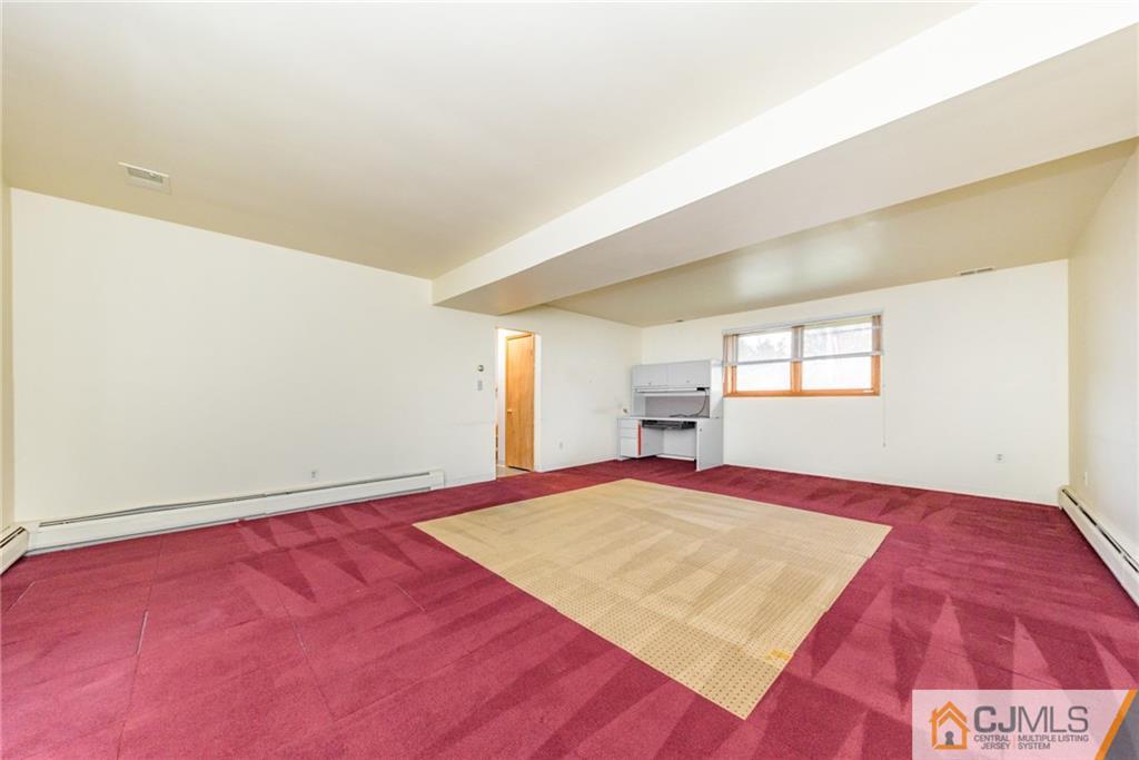111 Greymoor Road Howell, NJ 07731 - Photo 17 of 25 a bedroom with a bed and a window
