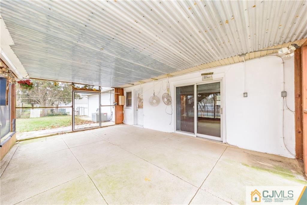 111 Greymoor Road Howell, NJ 07731 - Photo 21 of 25 a view of an empty room with a sliding door