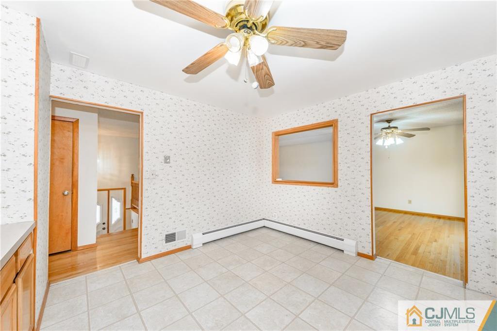 111 Greymoor Road Howell, NJ 07731 - Photo 7 of 25 wooden floor in an empty room and a window
