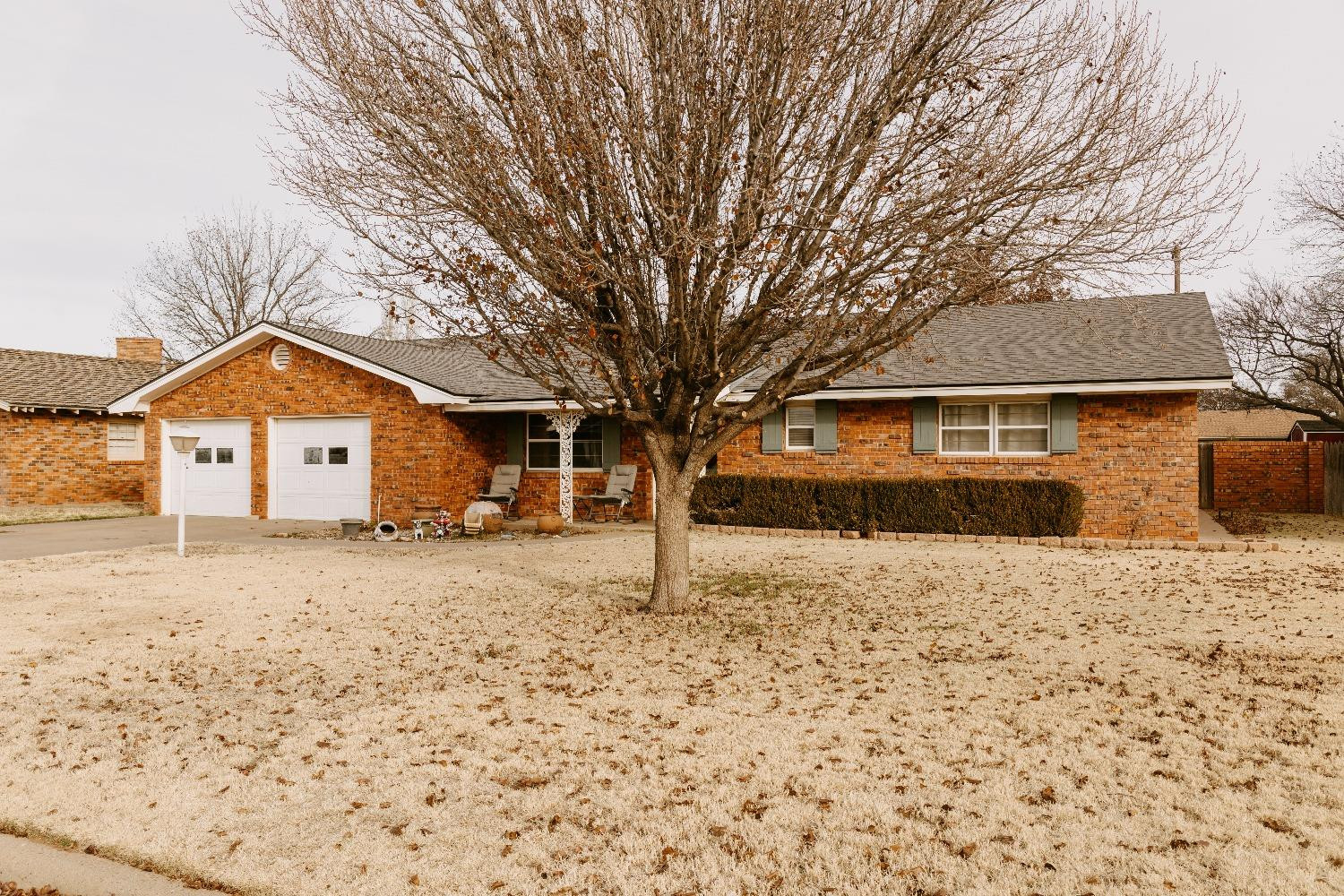 810 Itasca Street Plainview, TX 79072 - Photo 1 of 35 a house with trees in front of it