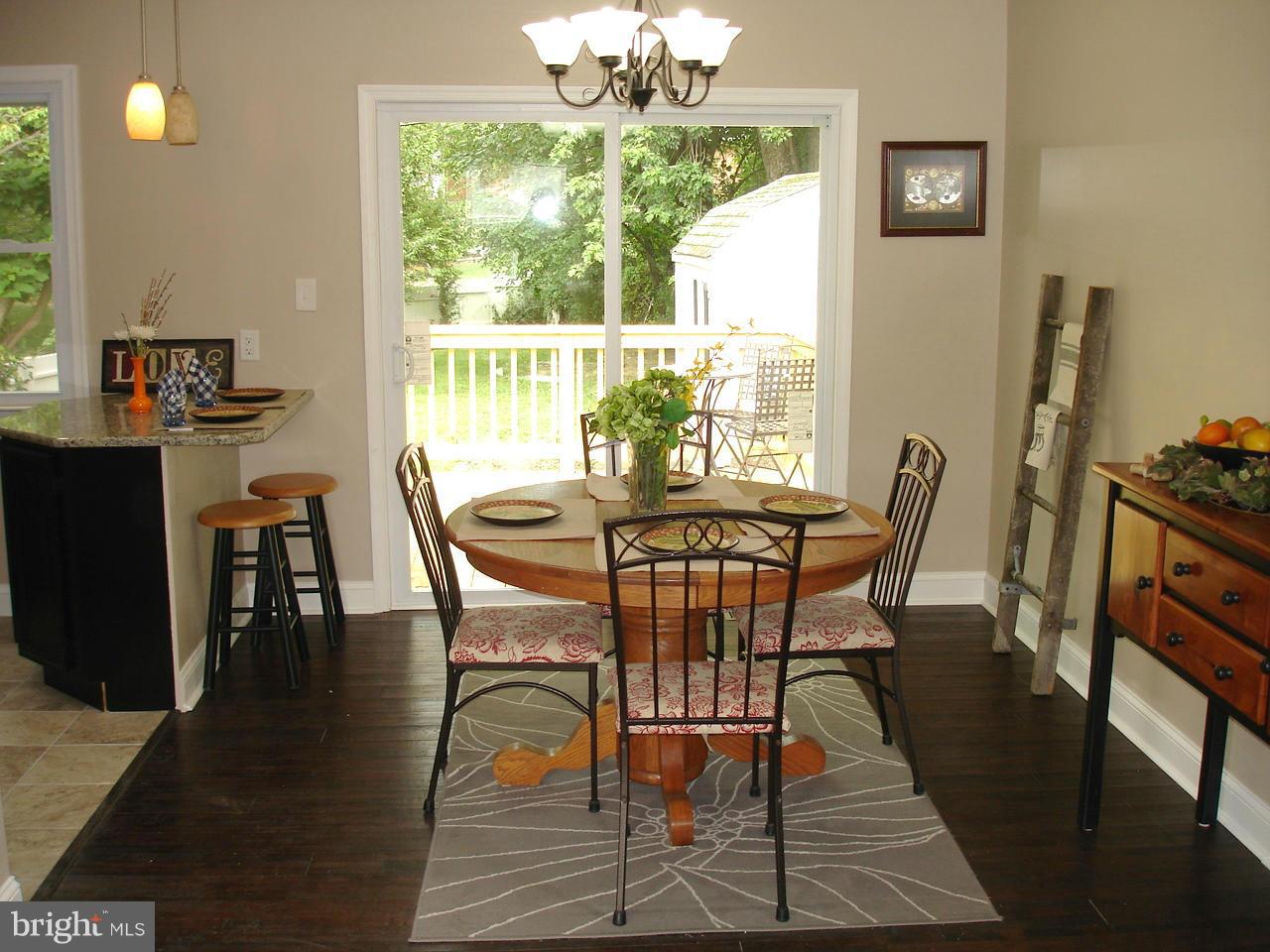 9138 Covered Bridge Road Baltimore, MD 21234 - Photo 4 of 30 DINING AREA CONNECTS TO KIT & SLIDERS TO NEW DECK
