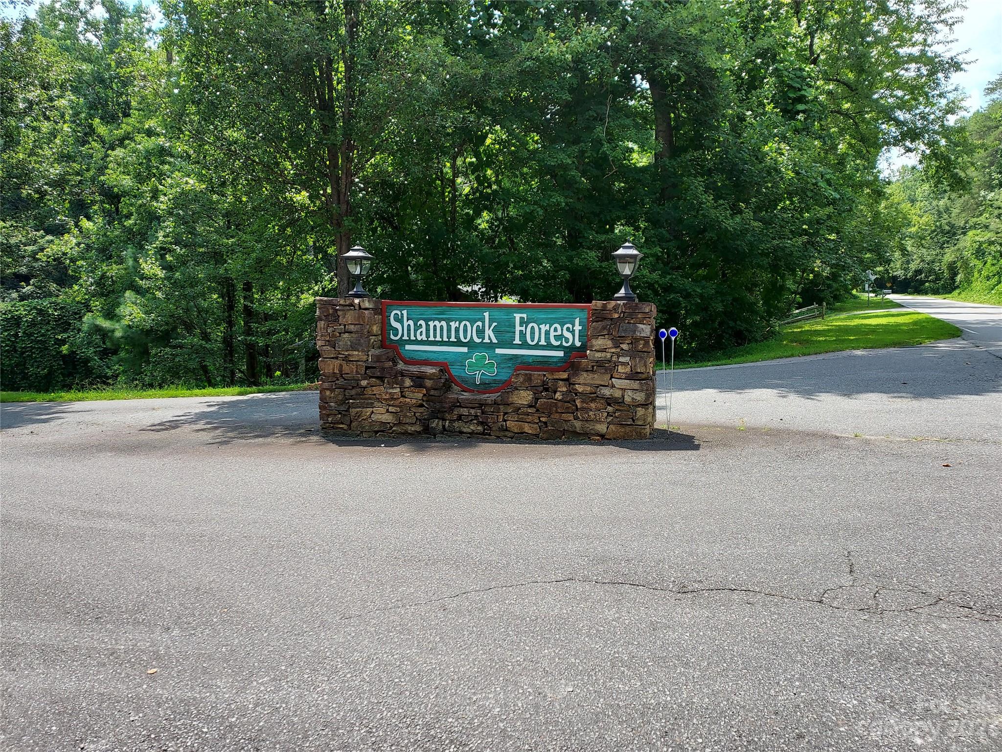 1534 State Road, Unit 67 Columbus, NC 28722 - Photo 3 of 8 a sign that is sitting on the side of a road