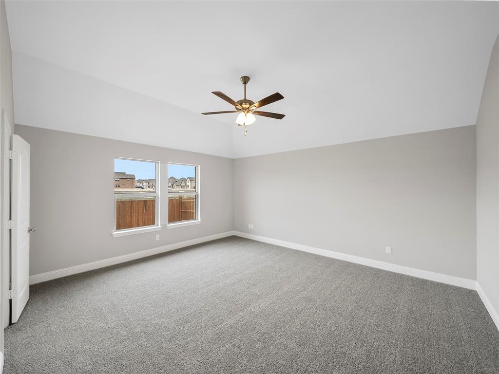 302 Pennington Road Josephine, TX 75173 - Photo 11 of 24 an empty room with a ceiling fan and window