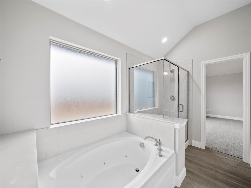 302 Pennington Road Josephine, TX 75173 - Photo 15 of 24 a bathroom with a bathtub and a shower