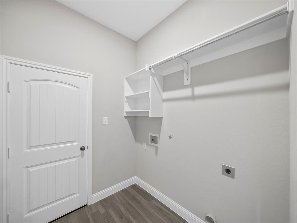 302 Pennington Road Josephine, TX 75173 - Photo 18 of 24 a view of walk in closet with empty racks