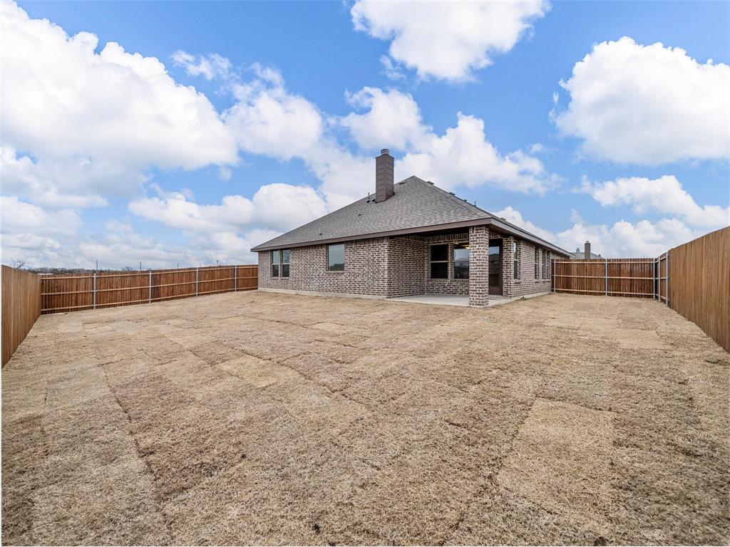 302 Pennington Road Josephine, TX 75173 - Photo 22 of 24 a backyard of a house with table and chairs