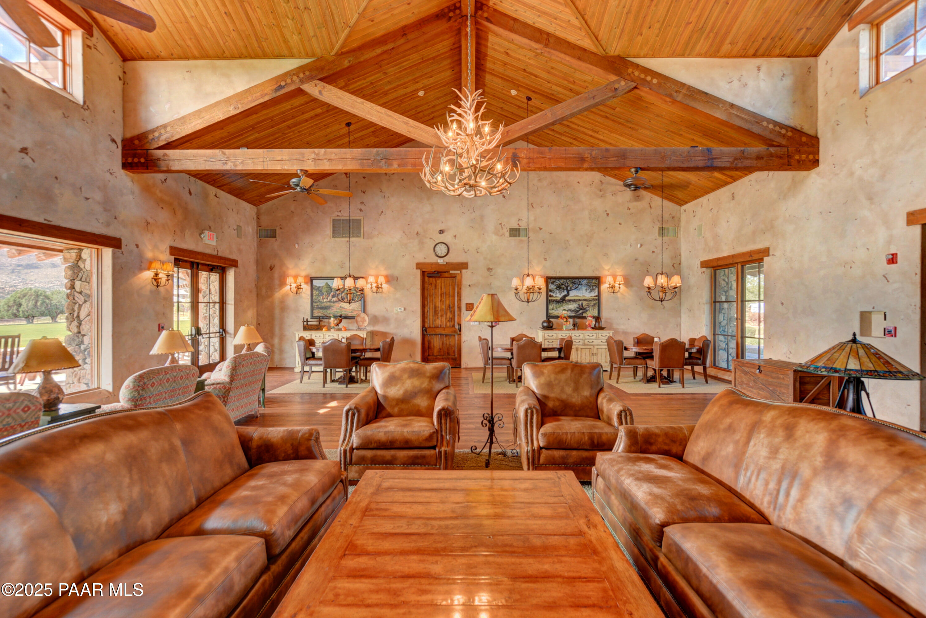 9875 North Equine Road Prescott, AZ 86305 - Photo 13 of 24 a living room with furniture and a chandelier