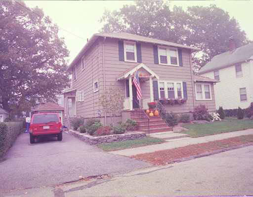 80 Reservation Road Milton, MA 02186 - Photo 1 of 1 a front view of a house with a yard